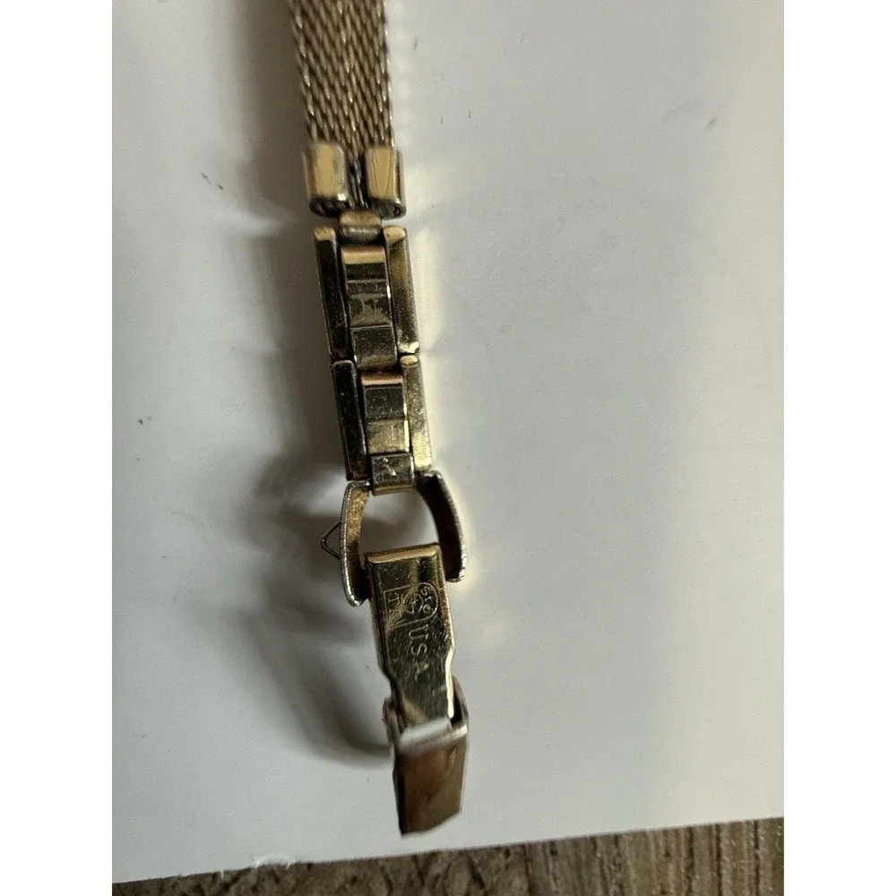 Vintage gold-tone women's mechanical watch by Bulova, manual-wind (mini model)